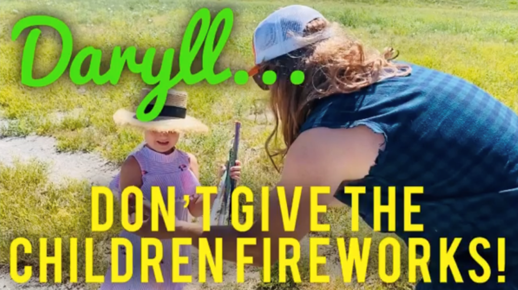 "Daryll... don't give the children fireworks!" man handing little girl a firework